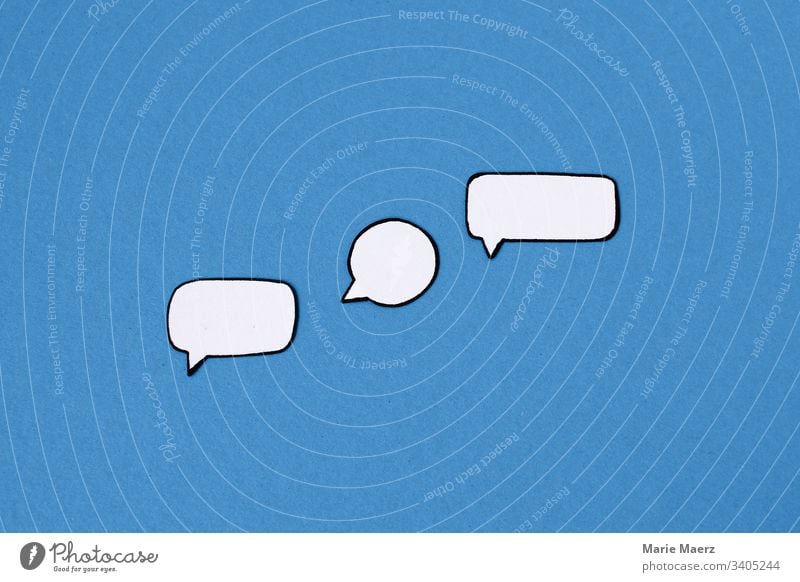 Three empty paper speech bubbles on a blue background Speech bubbles communication talk Chat Communicate Comic chat message Technology Internet Online