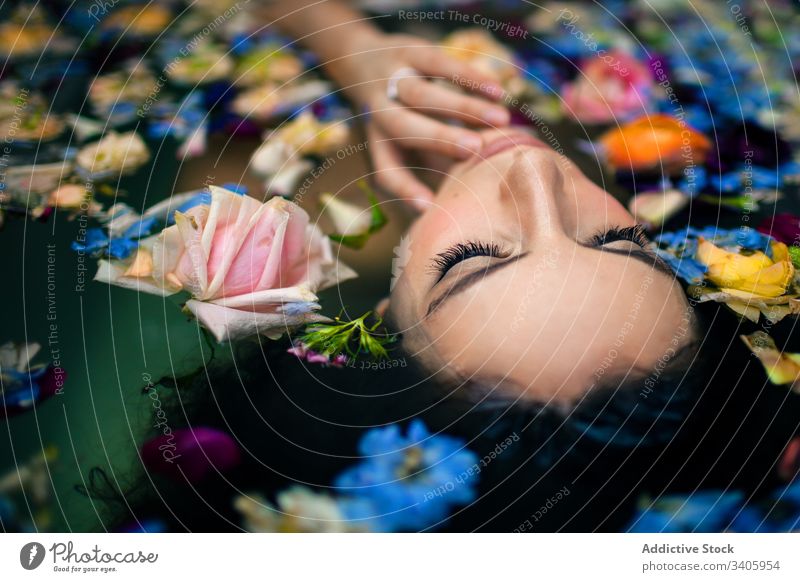 https://www.photocase.com/photos/3405954-sensual-woman-lying-in-water-with-flowers-bathtub-photocase-stock-photo-large.jpeg