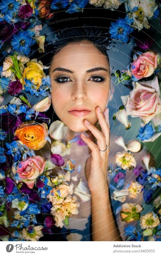 https://www.photocase.com/photos/3405955-a-pretty-woman-enjoying-relaxing-with-natural-flowers-photocase-stock-photo-large.jpeg