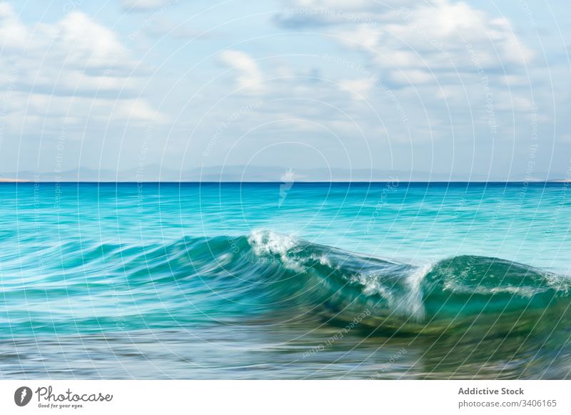 Turquoise sea waving on cloudy day wave water sky turquoise clean spain calo de sant agusti formentera ocean vacation nature summer idyllic blue beach sunny