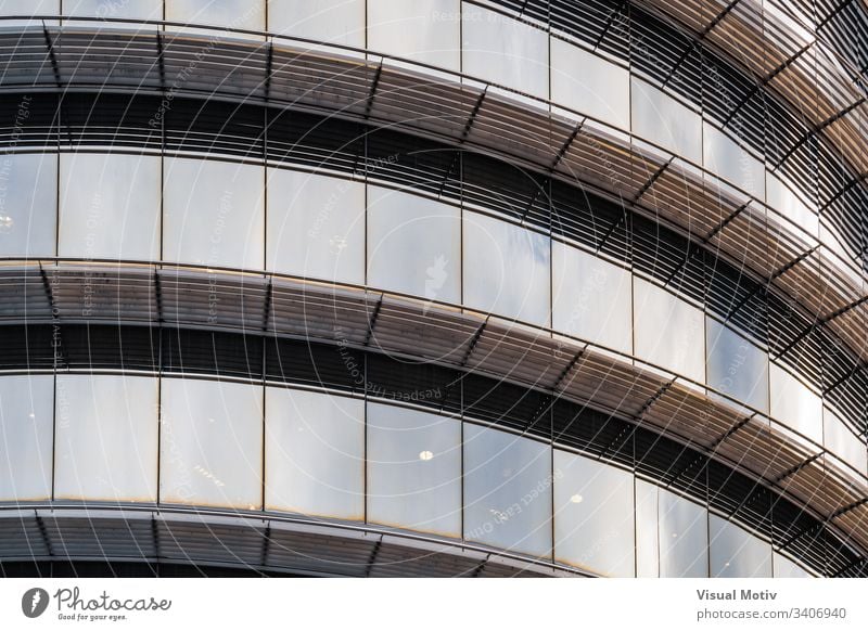 Light reflections on the curved glass of the windows of an office building abstract abstract background abstract photography afternoon architectonic