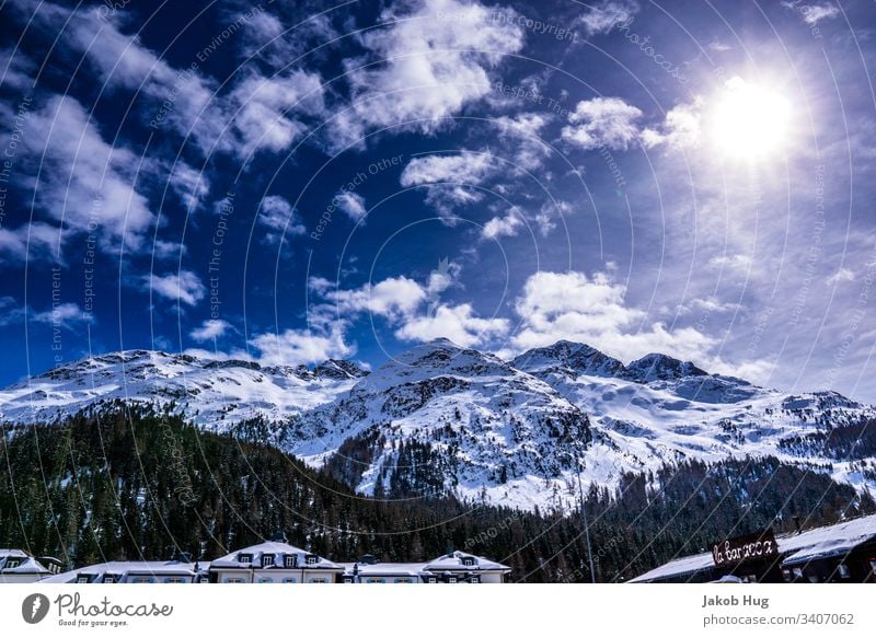 View of the Swiss Alps near St. Moritz with beautiful sky Switzerland Mountain mountains Sky Winter Blue Peak Snow Rock Clouds Ice Landscape Exterior shot