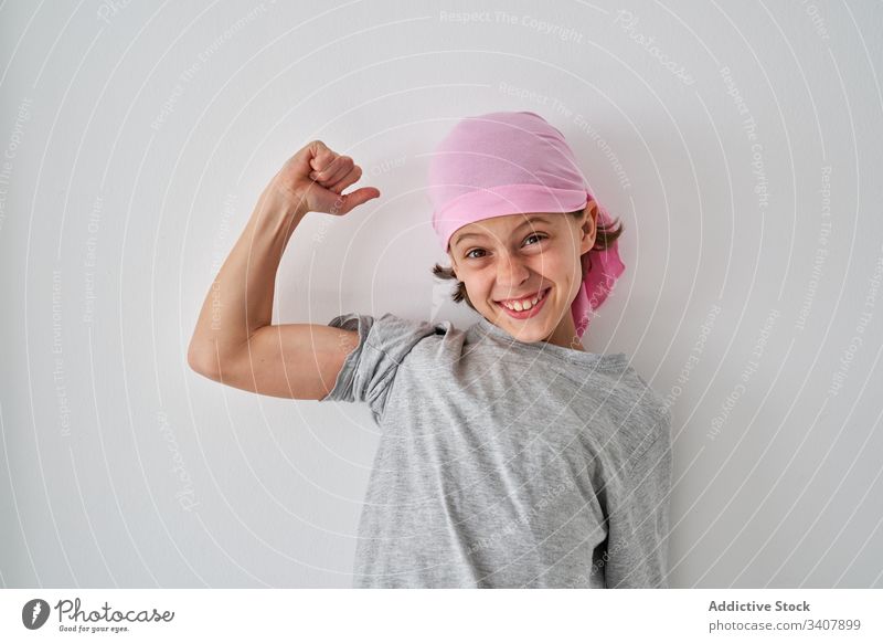 Courageous little boy against cancer at wall child diagnosis scream raise fist sick room male fight small strength willpower patient optimist gesture grimace