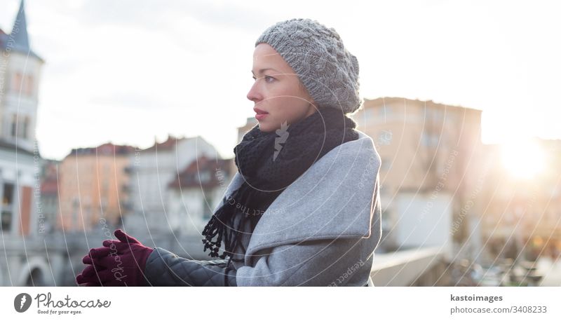 Beautiful young woman in Ljubljana in winter Woman Winter outdoors Cold cold temperature cold weather Scarf Cap Gloves Slovenia Old town cute season frost