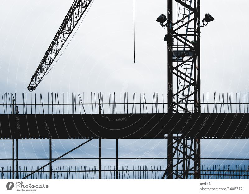 Structural Construction site Construction crane Silhouette Clouds Detail work Workplace Ambitious Above Thorny Work and employment Crane Exterior shot Sky