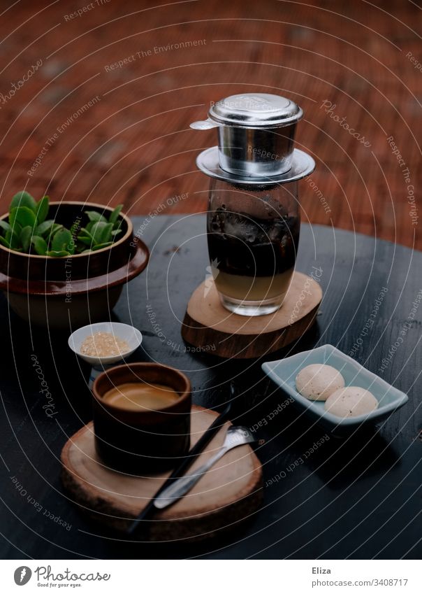 Traditional Vietnamese coffee with a cup filter served on a table in a café Cup filter Coffee phin Single cup filter Condensed milk Iced coffee Espresso