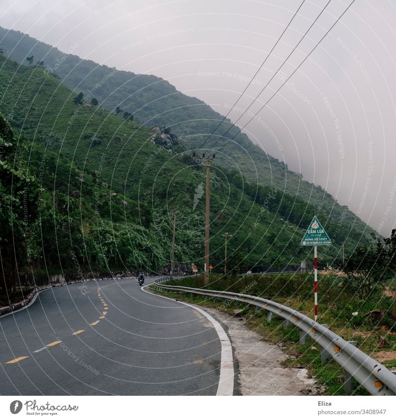 A road in Vietnam leading up to the Cloud Pass amidst green mountains and clouds Street Green Nature Exterior shot Colour photo Landscape Vacation & Travel