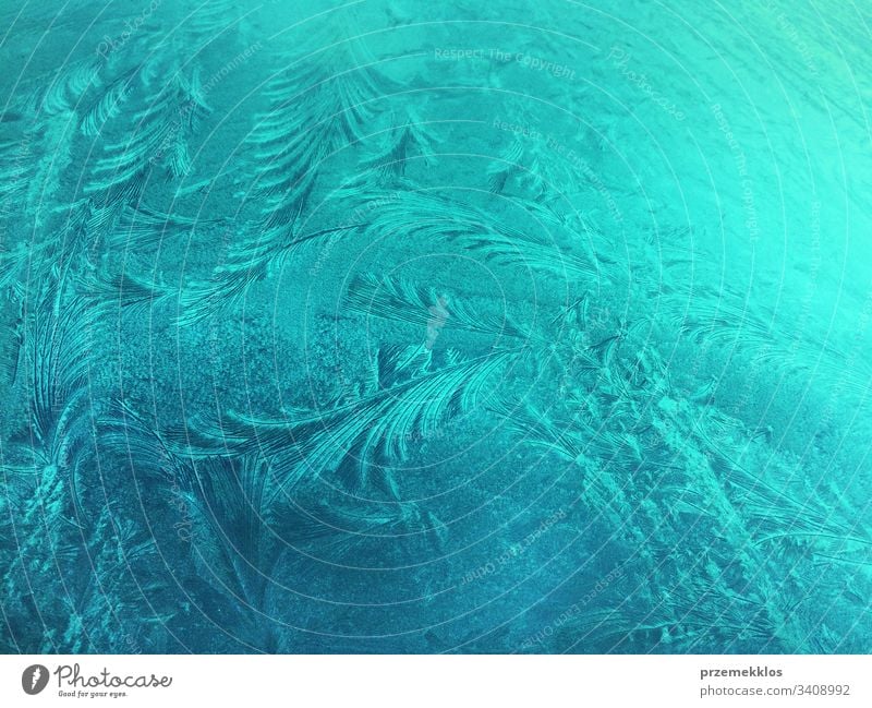 Frozen glass, ice flowers, winter background, abstract texture frost frozen icy cold snow snowflake crystal blue pattern bright frosty nature natural decoration