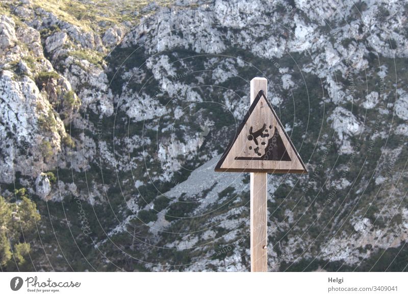 Warning sign Caution Danger of falling from rocks in the Tramuntana Mountains on Mallorca esteem Risk of collapse peril Signage Signs and labeling Threat Safety