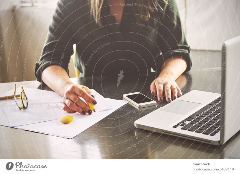 Architect woman sketching in her office laptop business phone mobile smart smartphone workplace computer hands breakfast keyboard desk table working technology