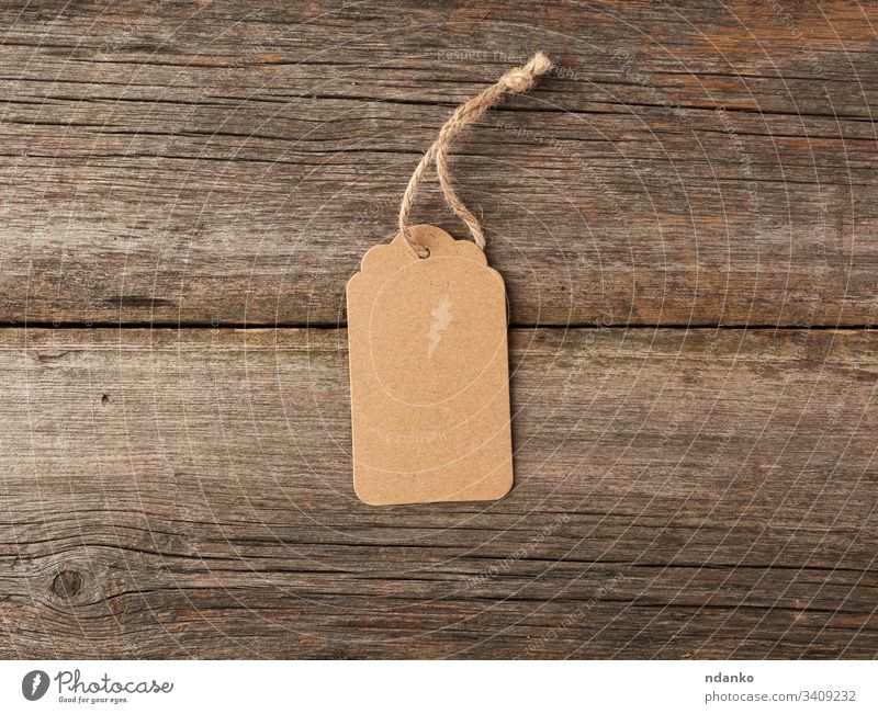 Blank Tag Tied Brown String Price Tag Gift Tag Sale Stock Photo by  ©YAYImages 260765868