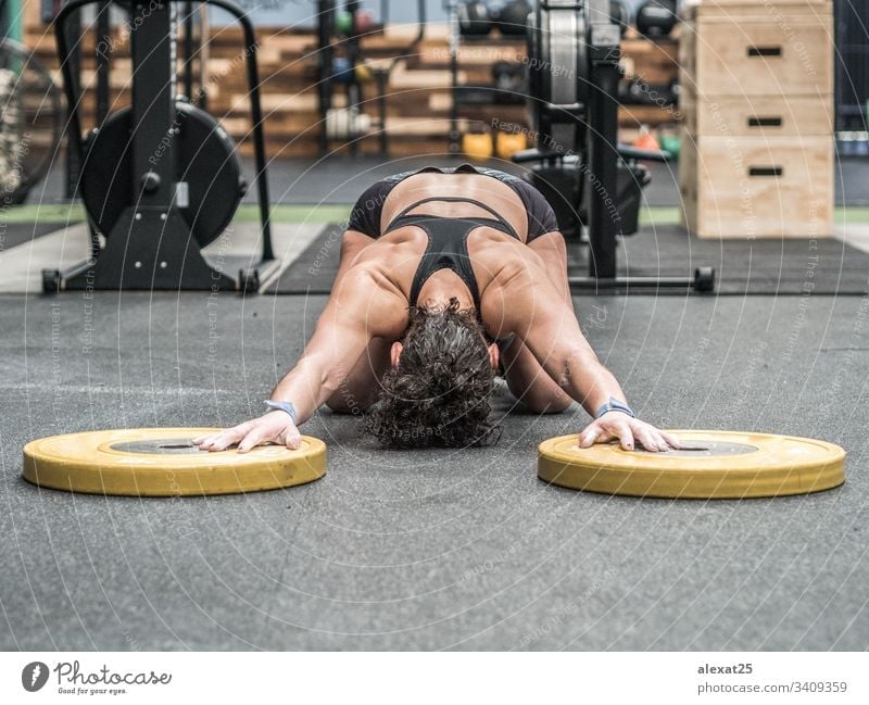 Middle-aged woman with fitness body working out on the terrace of her house  stock photo (228098) - YouWorkForThem