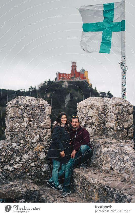 Couple Visiting Moorish Castle in Sintra, Portugal landscape tour tourism castelo architecture moorish horizontal history historical building lisboa mouros