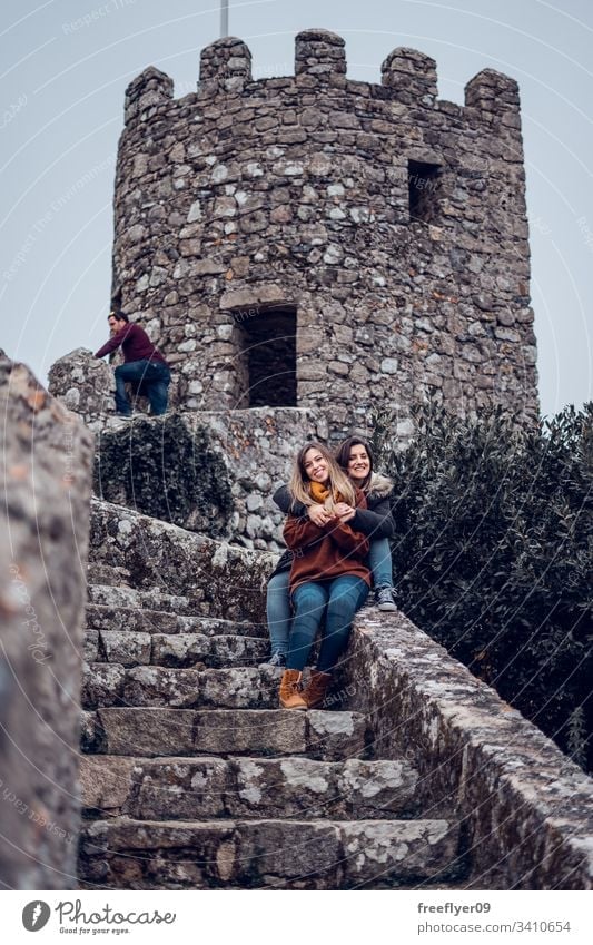 Two friends enjoying Moorish Castle in Sintra, Portugal landscape tour tourism castelo architecture moorish horizontal history historical building lisboa mouros