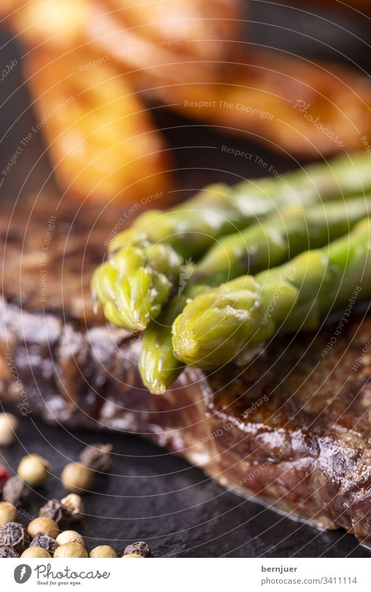 green asparagus on a steak Steak Asparagus Green beef steak French Pepper Peppercorn porterhouse fiorentina dry aged Vegetable potato boil Restaurant Close-up