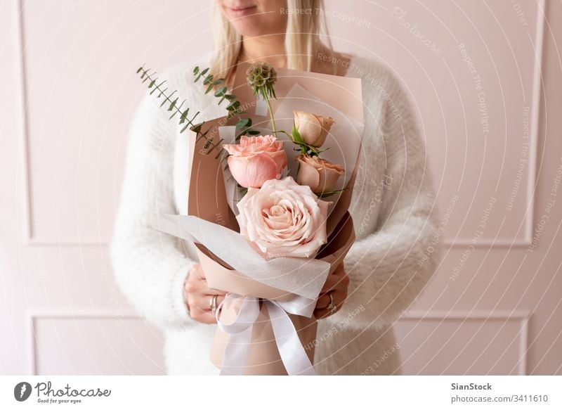 Bouquet of Soft Pink Flowers in Pink Wrapping Paper in Woman Hands Isolated  Stock Photo - Image of ranunculus, love: 218531566