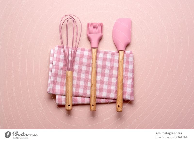 Kitchen utensils on a pink table. Colorful baking tools clean colorful concept cooking flat lay household kitchen kitchenware minimal minimalist mixer napkin