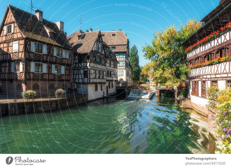 Strasbourg landscape on a sunny day. Ill river boat ride france alsace strasbourg alsatian french ill summer architecture houses spring hoolidays travel