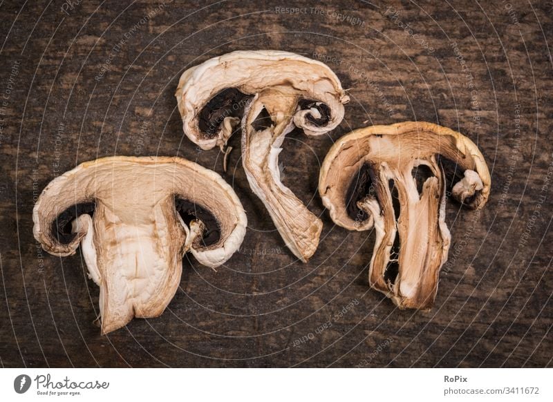 Dried mushrooms on a wooden background. Mushroom mushroom dish chanterelle food Eating food products germlings beggars Agaricomycotina Chanterelle