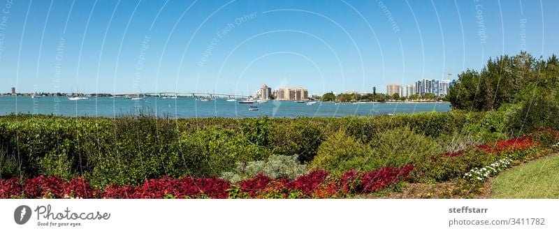 Sarasota Bay with the John Ringling Causeway bridge in the background Bench view boat sailboat boats bay seat chair rest waterfront view Florida tranquil calm