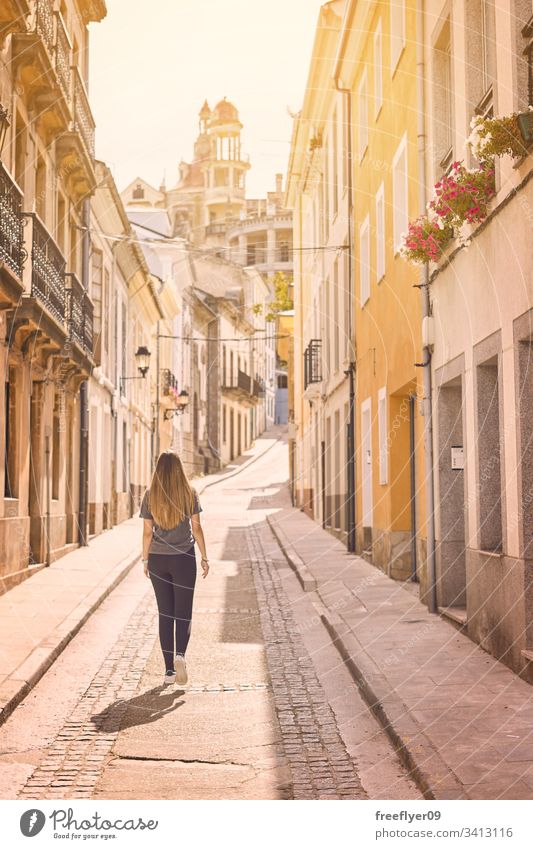 Young woman walking by the streets of the northern Spain ribadeo galicia tourism hiking one culture shape tour tourism detail travel place urban modernism lugo