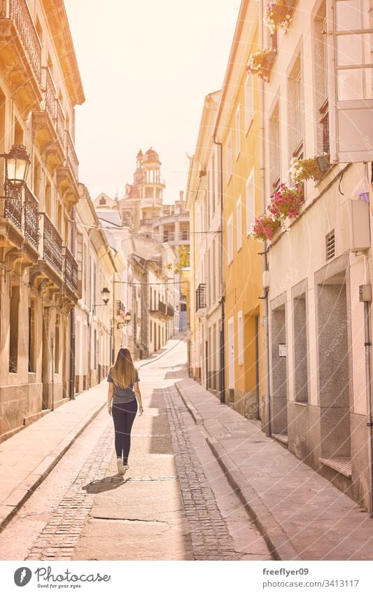 Young woman walking by the streets of the northern Spain ribadeo galicia tourism hiking one culture shape tour tourism detail travel place urban modernism lugo