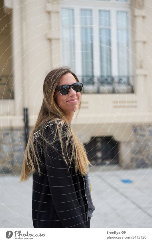 Young woman walking by the streets of Ribadeo, Galicia ribadeo galicia tourism hiking one culture shape tour tourism detail travel place urban modernism lugo