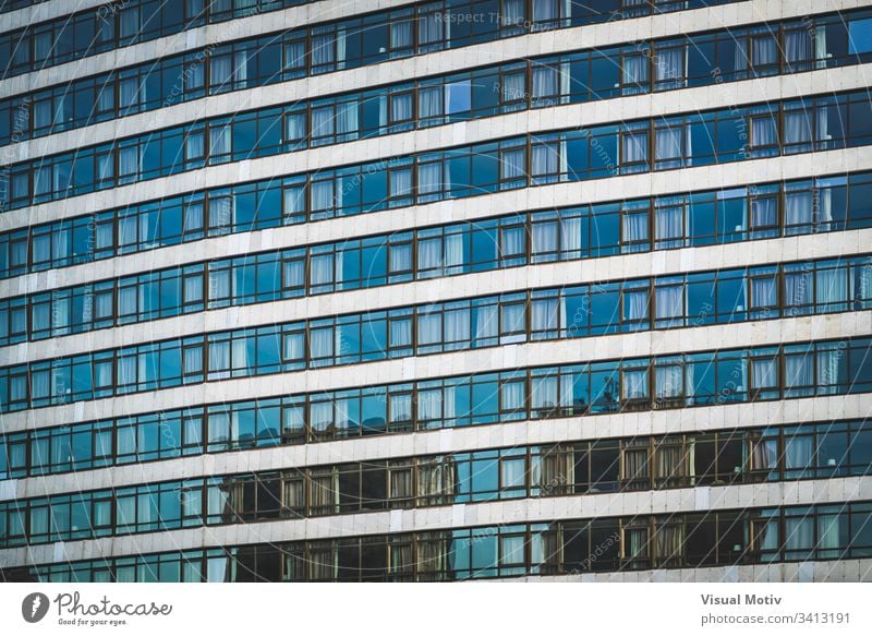 Rows of glazed windows of an urban building facade architecture architectural architectonic concrete color structure shapes abstract outdoors glass nobody