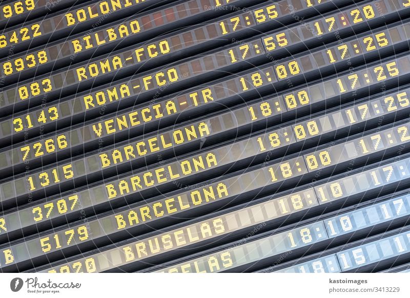 Flight information board at spanish airport terminal departure flight arrival schedule panel international display airplane airline timetable destination