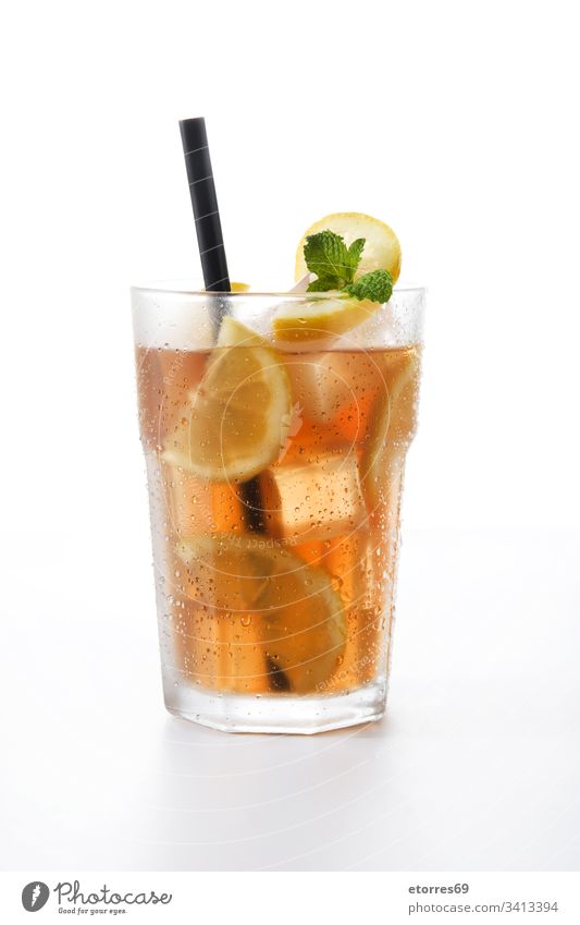 Iced tea drink in glass with lemon isolated on white background beverage brown citrus cocktail cold fresh fruit ice ice tea liquid mint refreshment straw summer