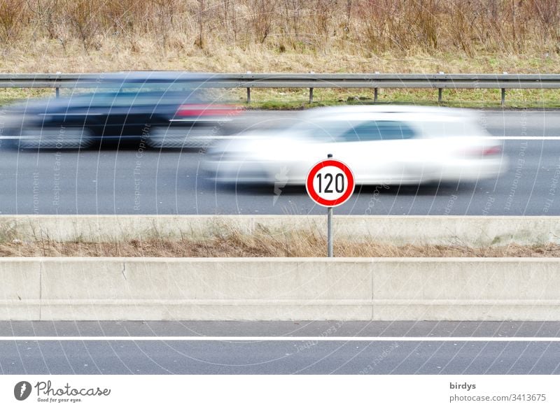 General speed limit of 120 km/h on German motorways, speed limit sign on motorway with moving traffic, moving cars in motion blur tempolimit Driving