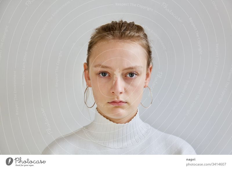 Portrait Of 10 Year Old Girl With Serious Face On A White Background. It  Takes With Natural Light That Enters Through A Window. Stock Photo, Picture  and Royalty Free Image. Image 80380257.