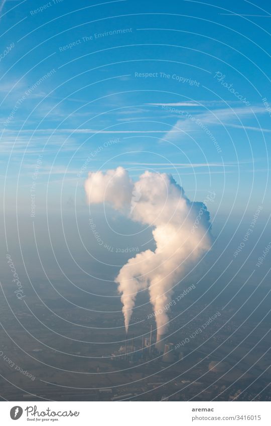 Aerial view of a power plant with cooling tower clouds in a blue sky aerial photograph power station Cooling tower Water steam Exhaust gas Smog Blue Sky