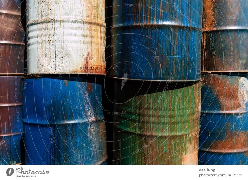 Different barrels stacked to a wall Threat Environmental damage Part Dry Background picture Environmental protection Damage Crack & Rip & Tear Bizarre Gloomy