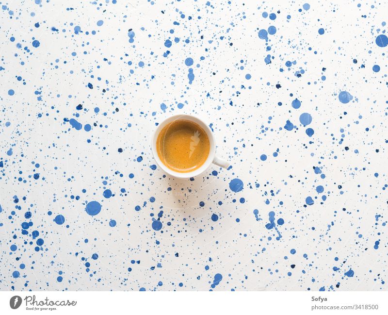 Cup of coffee on abstract background. Flat lay cup espresso drink hot morning breakfast food concept italian beverage relax white blue texture bright paint