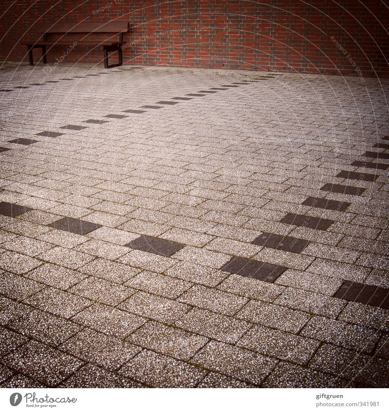 parked Wall (barrier) Wall (building) Sit Bench Seating Parking lot Brick Stone floor Line Structures and shapes Loneliness Empty Gray Whimsical Perspective
