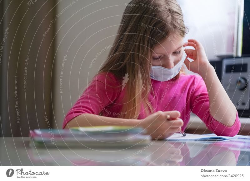 Coronavirus home school concept, quarantine. Girl doing homework. academic background book caucasian child childhood class computer coronavirus course cute