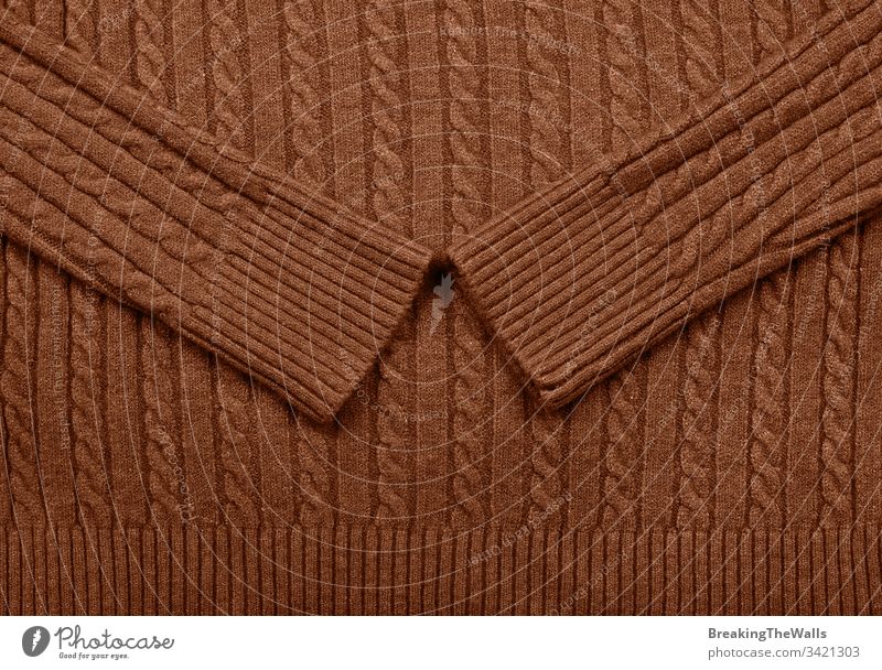Background texture of brown knitted wool fabric Knitware dark vivid background pattern cable sweater braid tricot knitting jersey hosiery textile wear warm