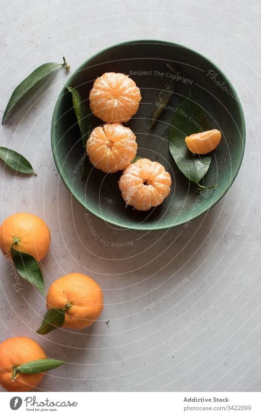 Fresh mandarins fruits on table tangerine citrus fresh orange natural peel leaf bowl food tasty delicious juice organic healthy sweet ripe vitamin vegetarian