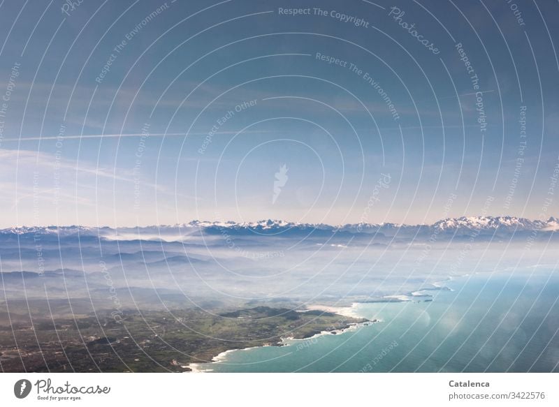 View from the airplane window | corona thoughts Aerial photograph Bird's-eye view Horizon coast Ocean Sky Mountain range Village Town Clouds Tall Airplane