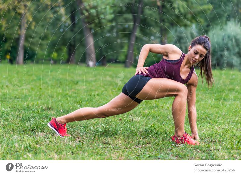 Beautiful Athletic Women Excercises In A Park Stock Photo, Picture