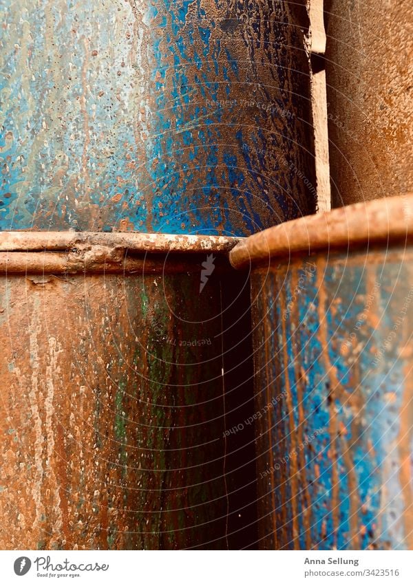 Rusty stacked metal barrels Abstract Obscure Structures and shapes Close-up Multicoloured Pattern Detail Background picture Exceptional Design Deserted