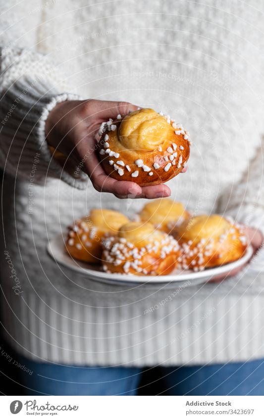 Woman holding plate with buns food bake homemade woman tasty pastry sweet yummy fresh nutrition appetizing eat cook culinary winter season tradition female