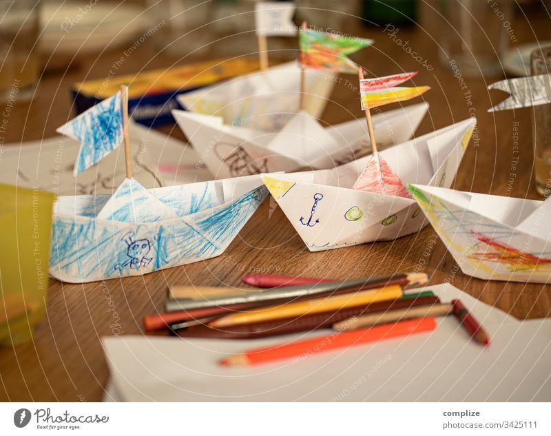 Paper ships made and painted by children Parenting Kindergarten kita Paper boat Handicraft pencil box pens Painting (action, artwork) Draw Creativity creatively