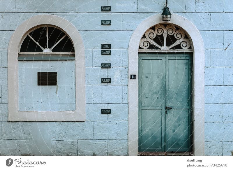 Weathered facade with turquoise door Facade House (Residential Structure) Window Arrangement Deserted Architecture Exterior shot Abstract Esthetic Building