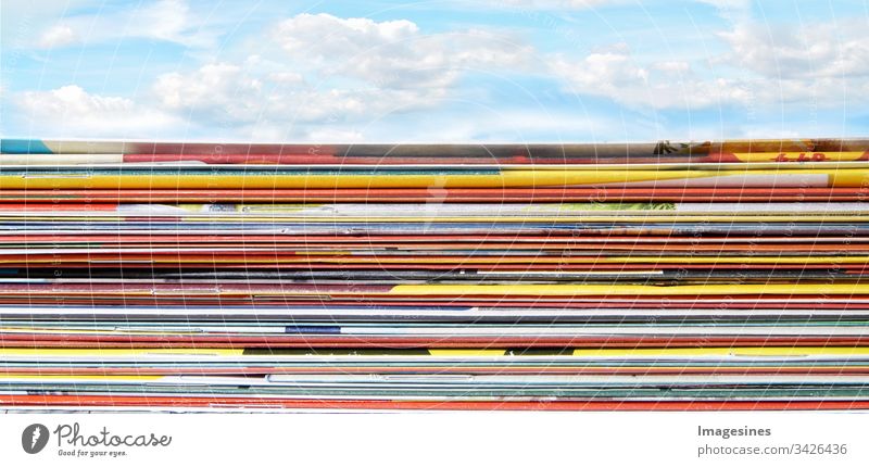 Panorama stacks of supermarket advertising - advertising brochures. Folded, stacked pages with discount flyer on sky background announce flyers Advertising