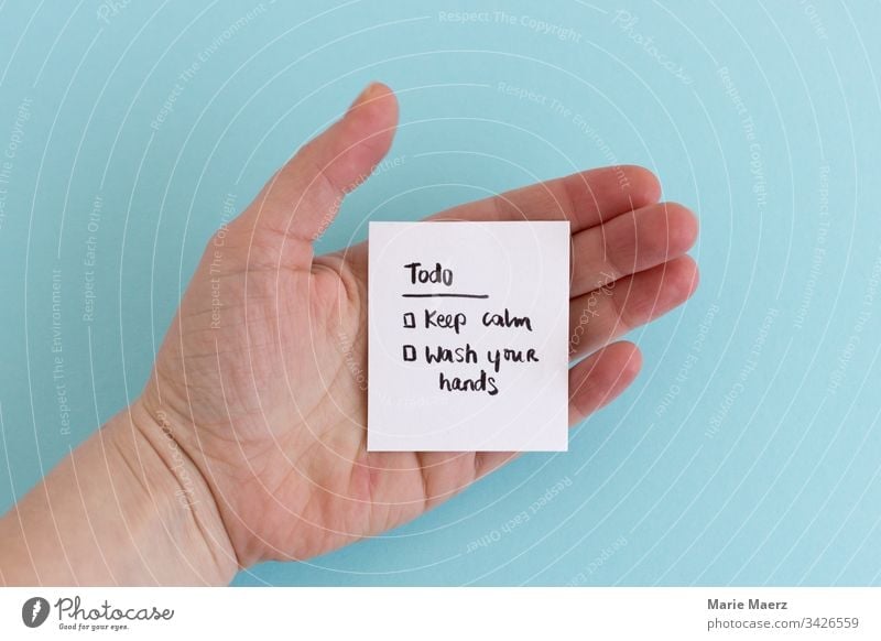 Todo: Keep calm & wash your hands | Hand holding a todo list during coronavirus crisis keep calm wash hands hygiene sign paper Personal hygiene Clean Healthy