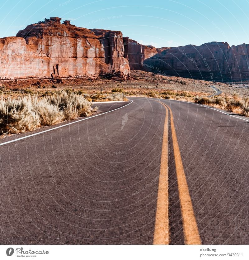 Road in Arches National Park Expedition Climate change Utah Formation Arched bridge Brilliant Bright West Warmth Vacation destination Wide angle Drought Day