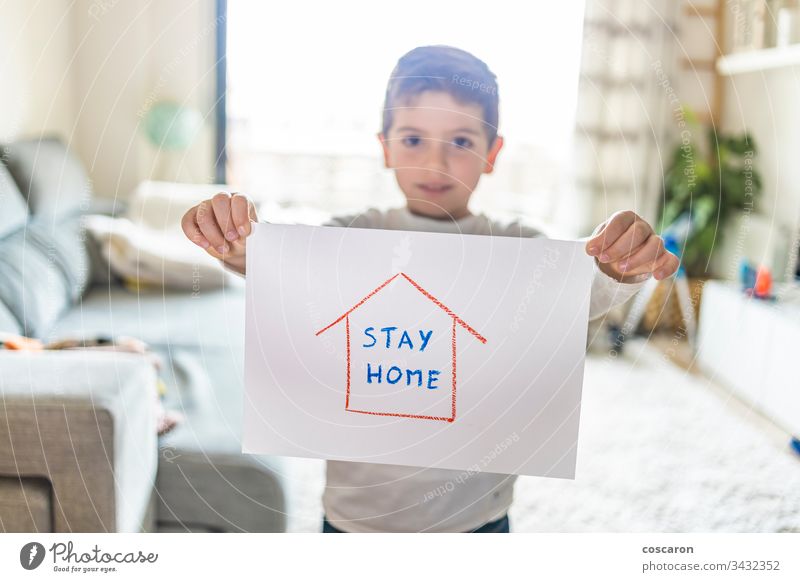 Little kid with Stay Home draw. Coronavirus concept advertisement advisory avoid background banner child childhood children corona coronavirus