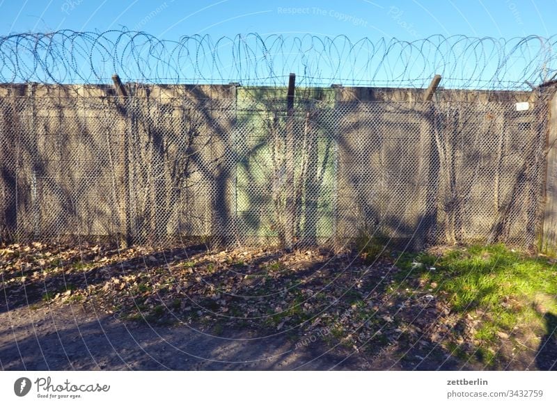 wall on the outside Deserted Copy Space Wall (barrier) Border Barbed wire foreclosure Real estate Fence Exclusion demarcation NATO wire Backup Collateralization